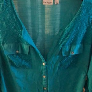 Almost a teal green blouse, never worn.